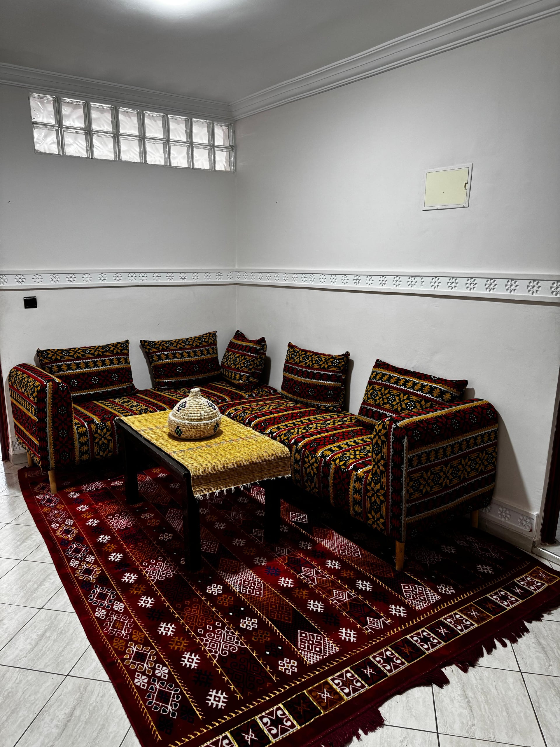 Nomad Spirit Hotel traditional Moroccan salon with handwoven banquettes