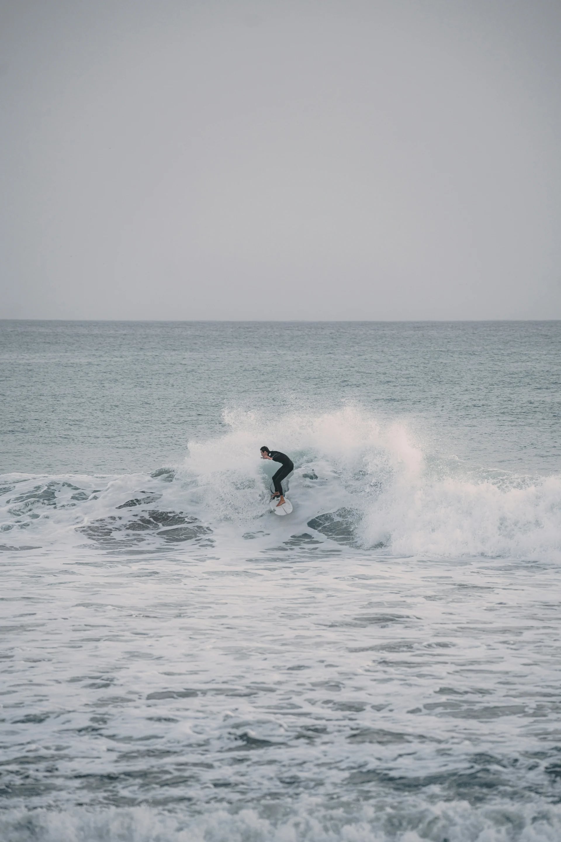 Surfer carving a wave on the Moroccan Atlantic coast at Tamraght